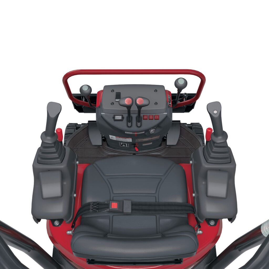 Robuuste tractorbestuurderscabine met geavanceerde bedieningspanelen en ergonomisch ontwerp.