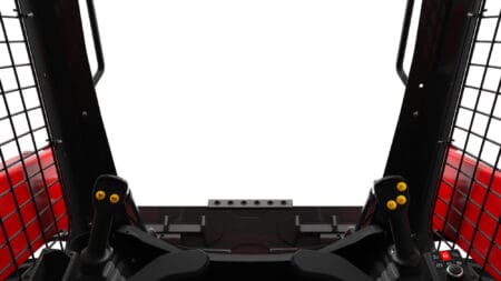 Zandbakbesturing met digitale displays en ergonomische joystickbediening.