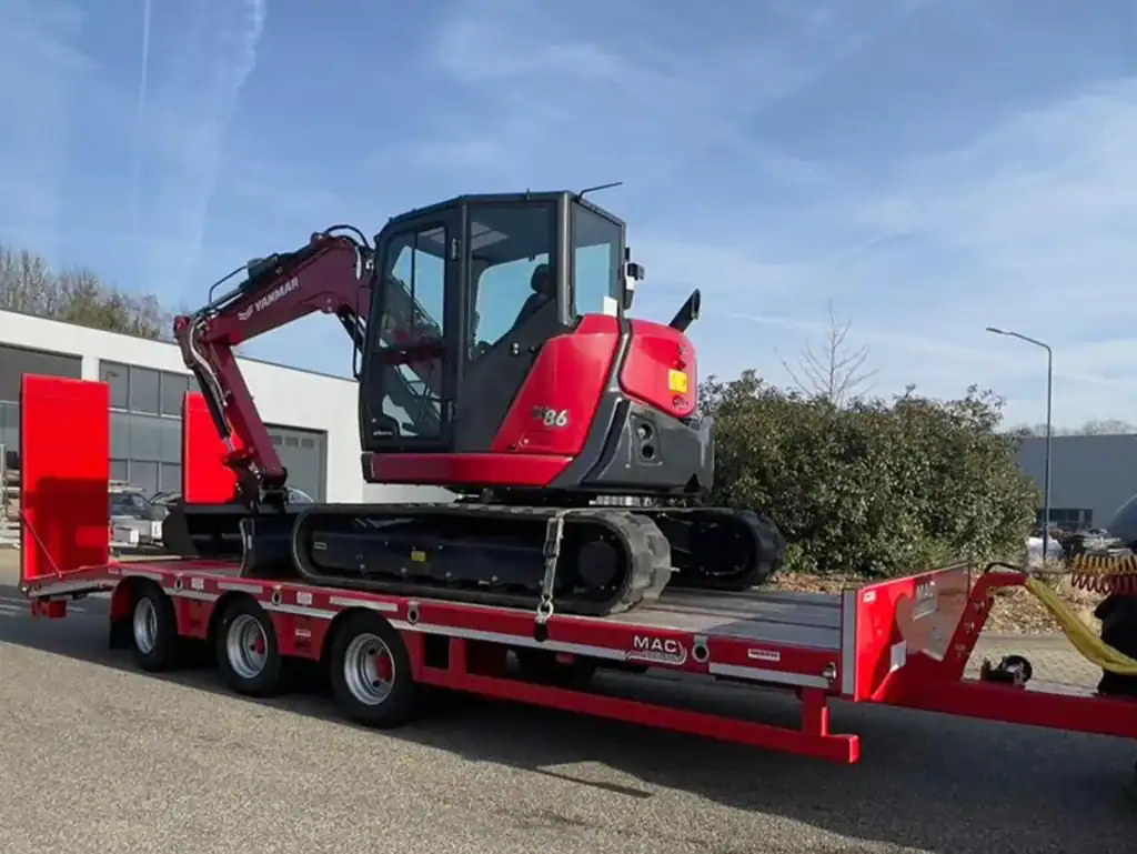 1. Mini graafmachine op transportwagen voor zwaar machinedoeleinden.