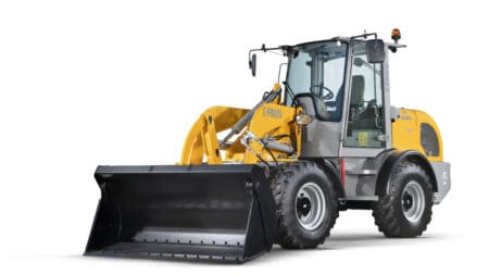 Standaard tractor met voorlader voor bouw- en tuinwerkzaamheden.