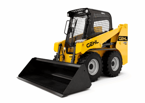 Kleiner wielzwenkbare wiellader met cabine en oprijplaat, geschikt voor bouw en tuinwerk.